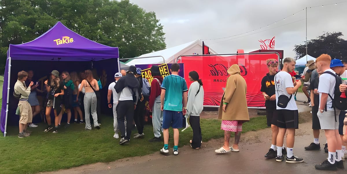 Sampling team handing out Takis to a queue at NASS festival