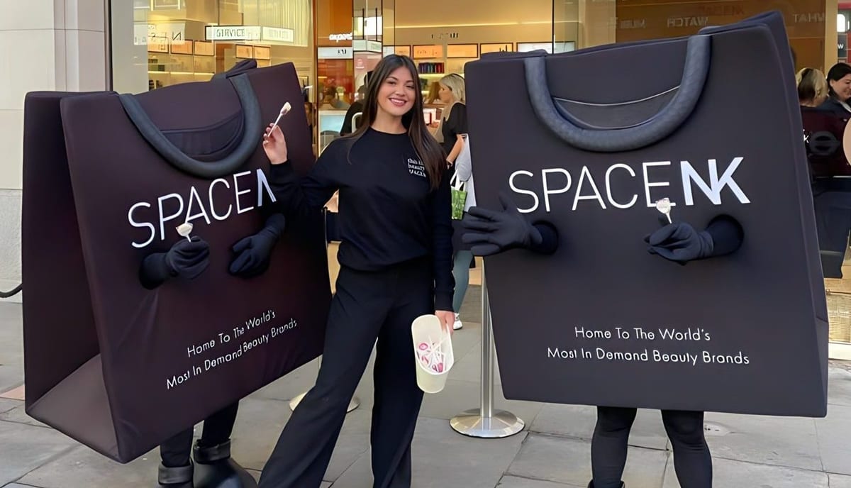 Space NK store promotion team with two walking bag characters