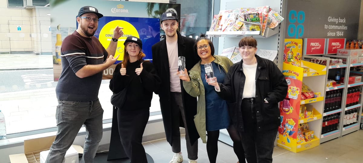 Staff with the store team at a Corona in-store event in a Co-op