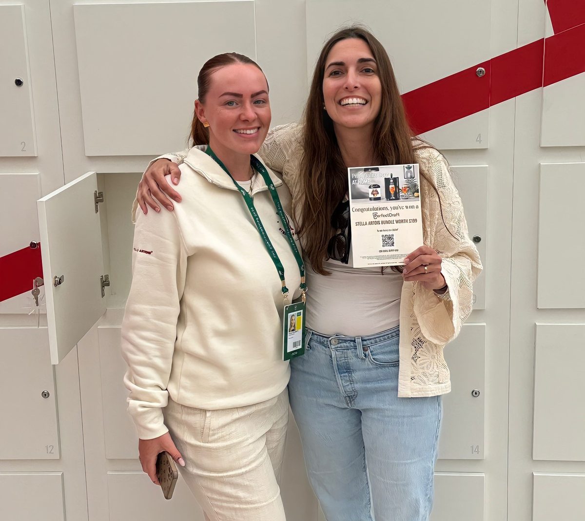 Two promotional staff in Stella Artois uniforms at a brand event