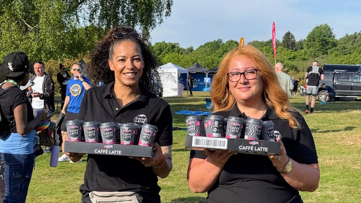 Emmi Caffè Latte sampling staff with trays of drinks at the Birmingham Half Marathon