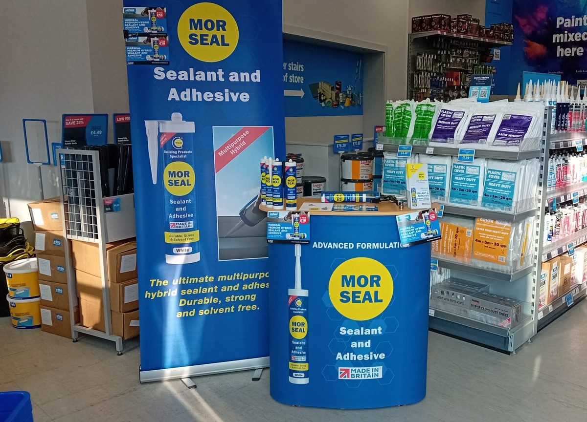 Demonstrator showing Morseal sealant to shoppers in a retail aisle