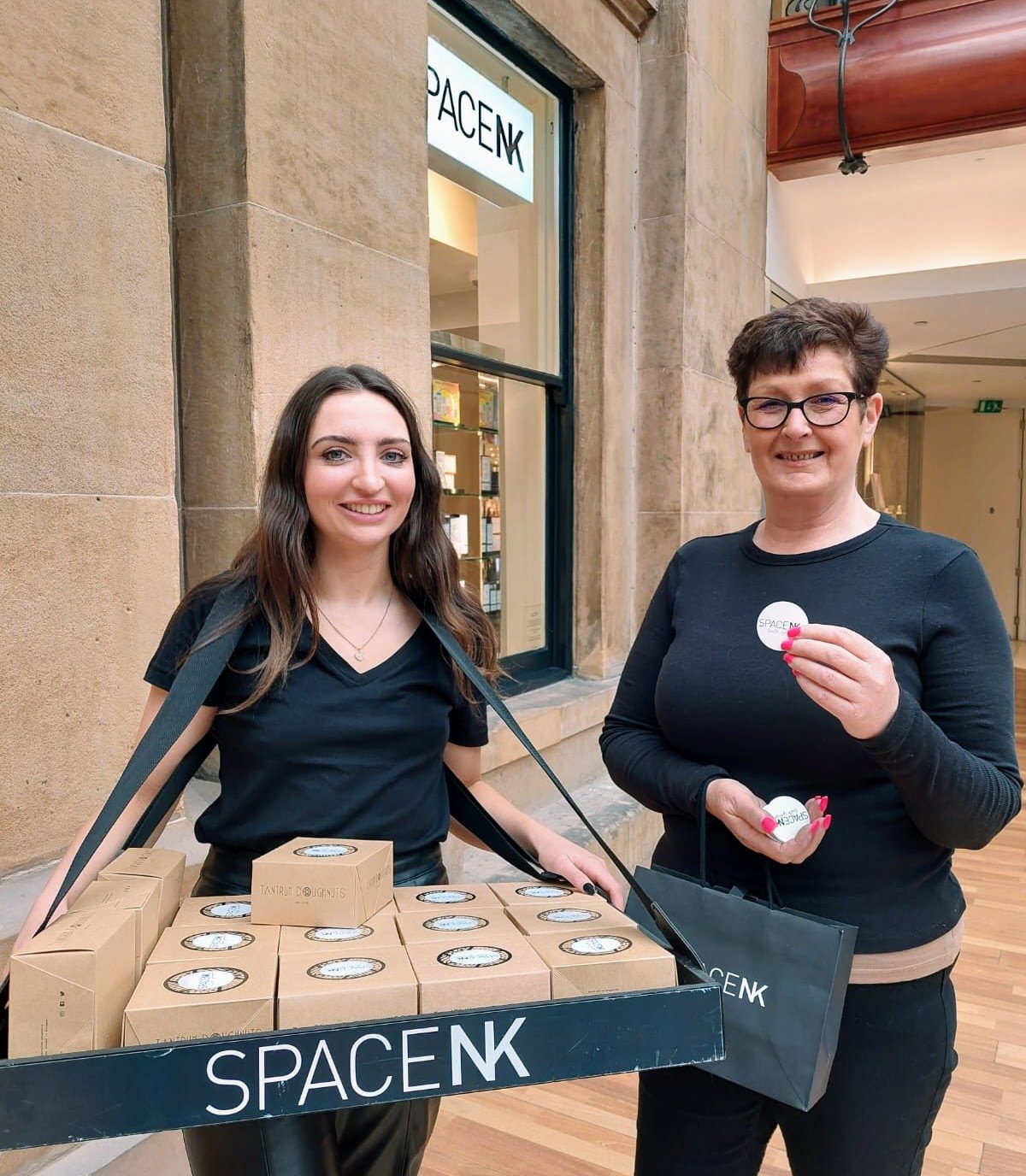 Promotional staff handing out samples at the Space NK Glasgow re-opening