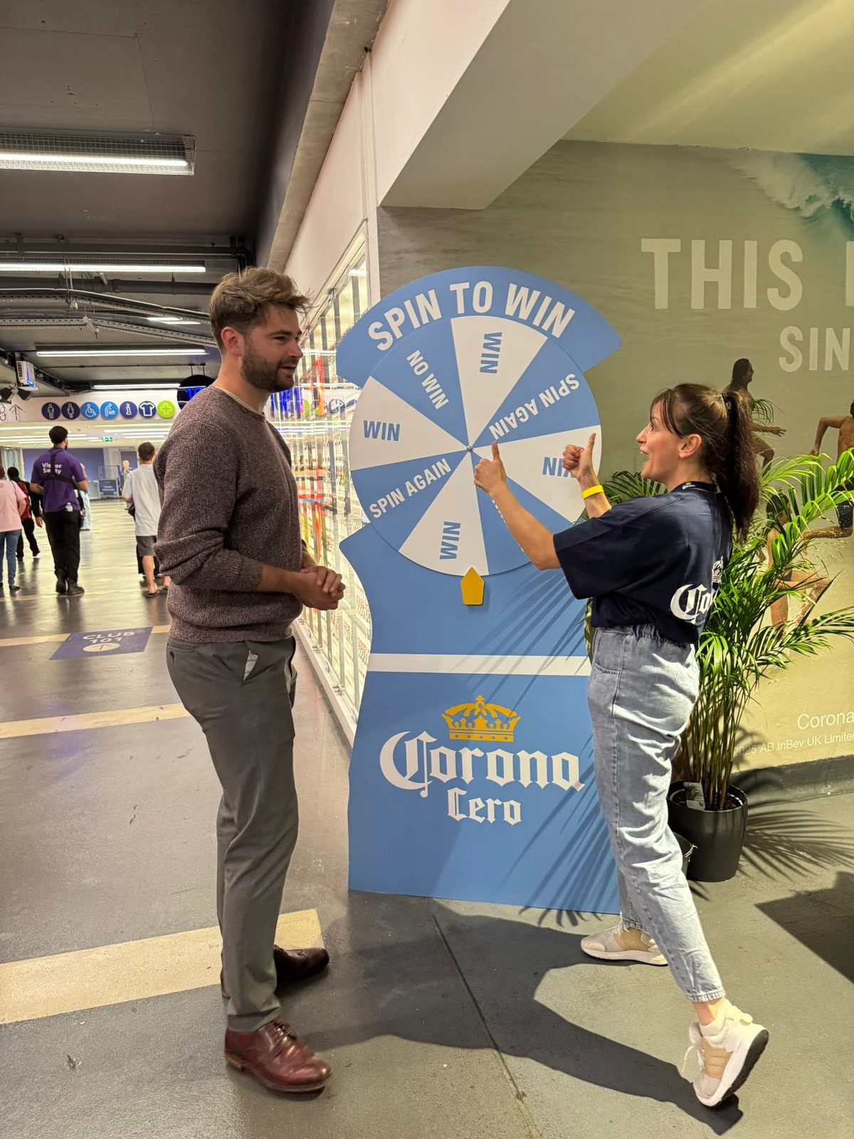 Executional host running a spin-to-win game at a London venue