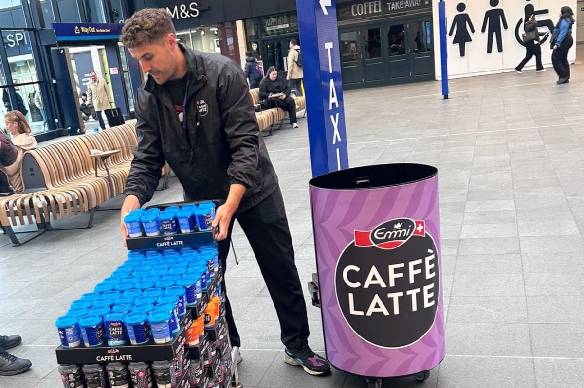 Executional team greeting commuters at Leeds Station
