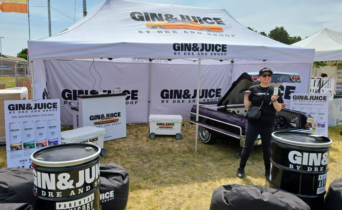 Brand ambassadors serving Gin & Juice cans from the Impala bar at Bournemouth 7s