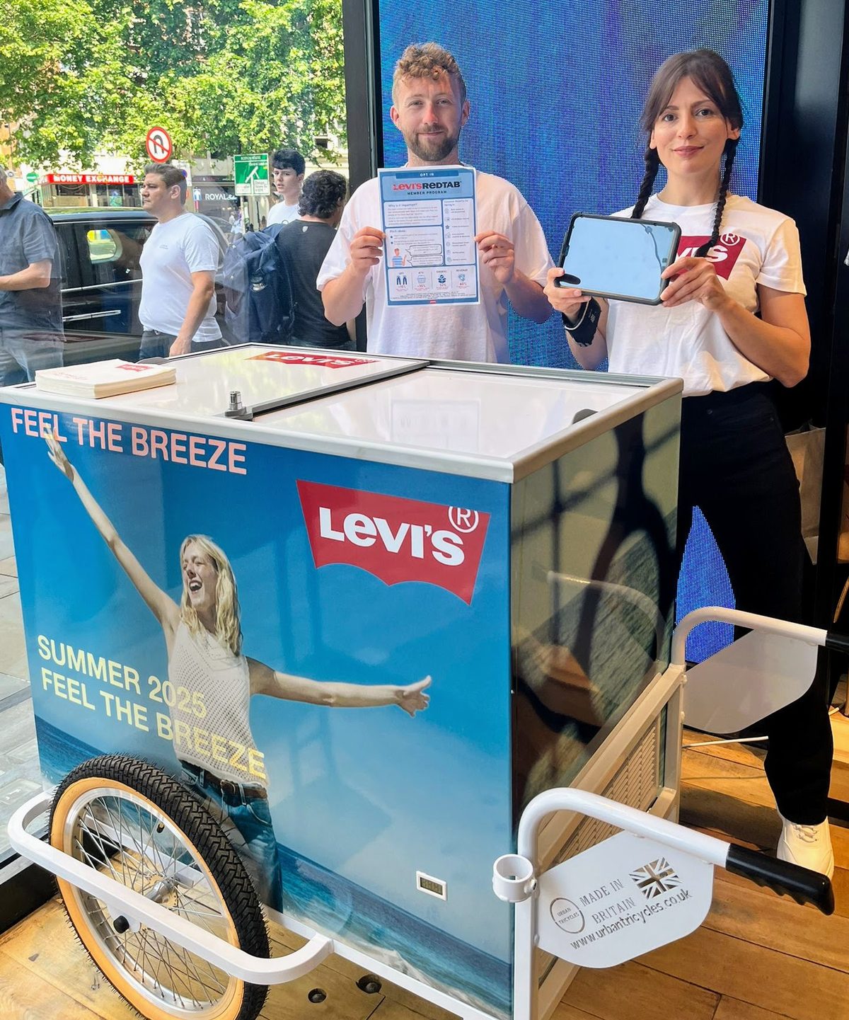 Two promotional staff with a Levi's cart at a London retail activation