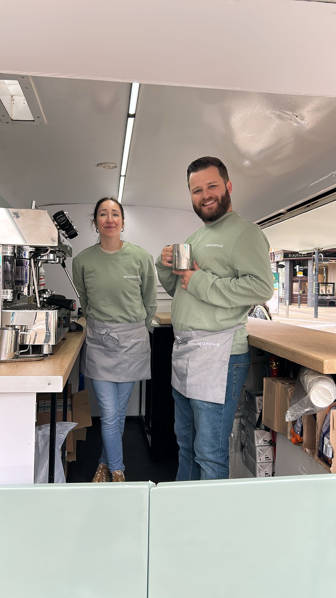 Morphe pop-up team smiling beside the branded van