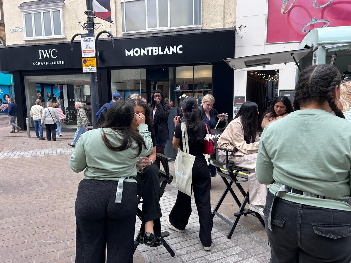 Brand ambassadors guiding visitors through the Morphe cosmetics pop-up