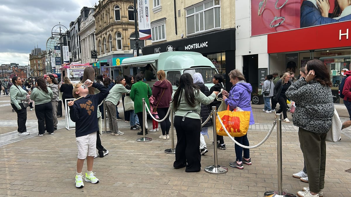 Brand ambassadors serving a queue at the Morphe pop-up van