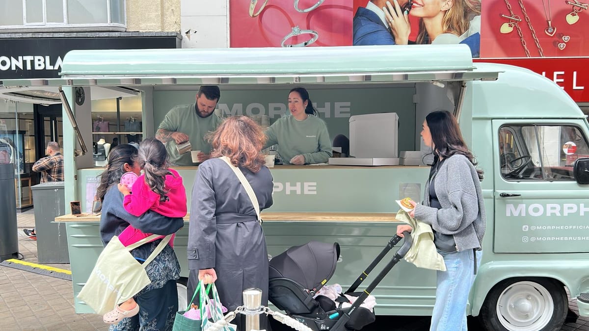 Morphe brand ambassadors serving visitors at the pop-up van