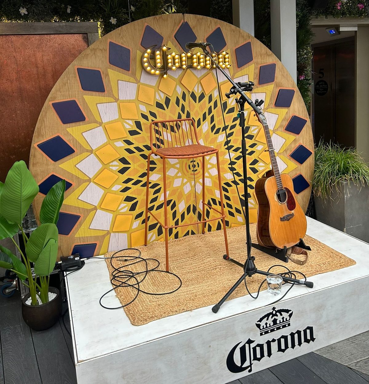 Executional promotional staff greeting guests beside the Corona stage at the Hippodrome