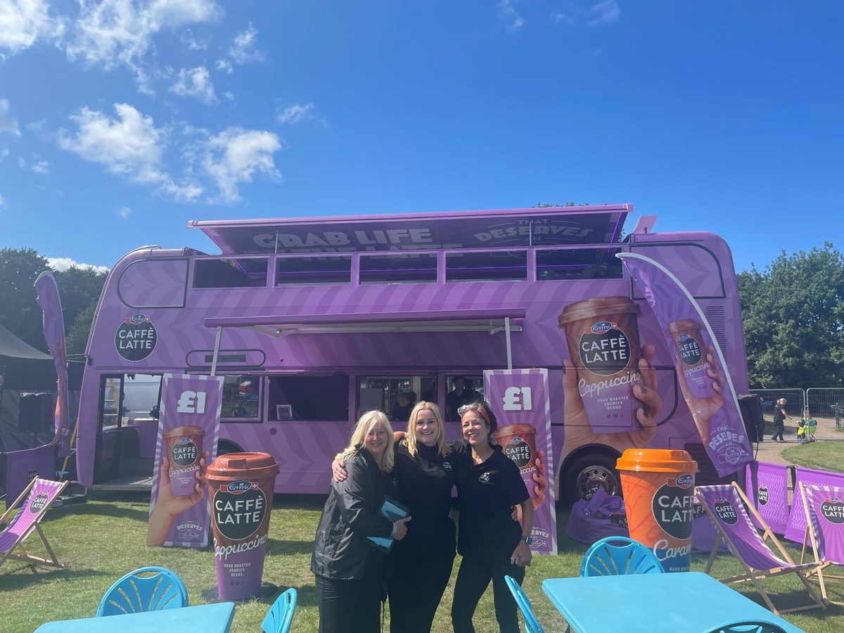 Executional roadshow team with the Emmi Caffè Latte bus at Heaton Park, Manchester