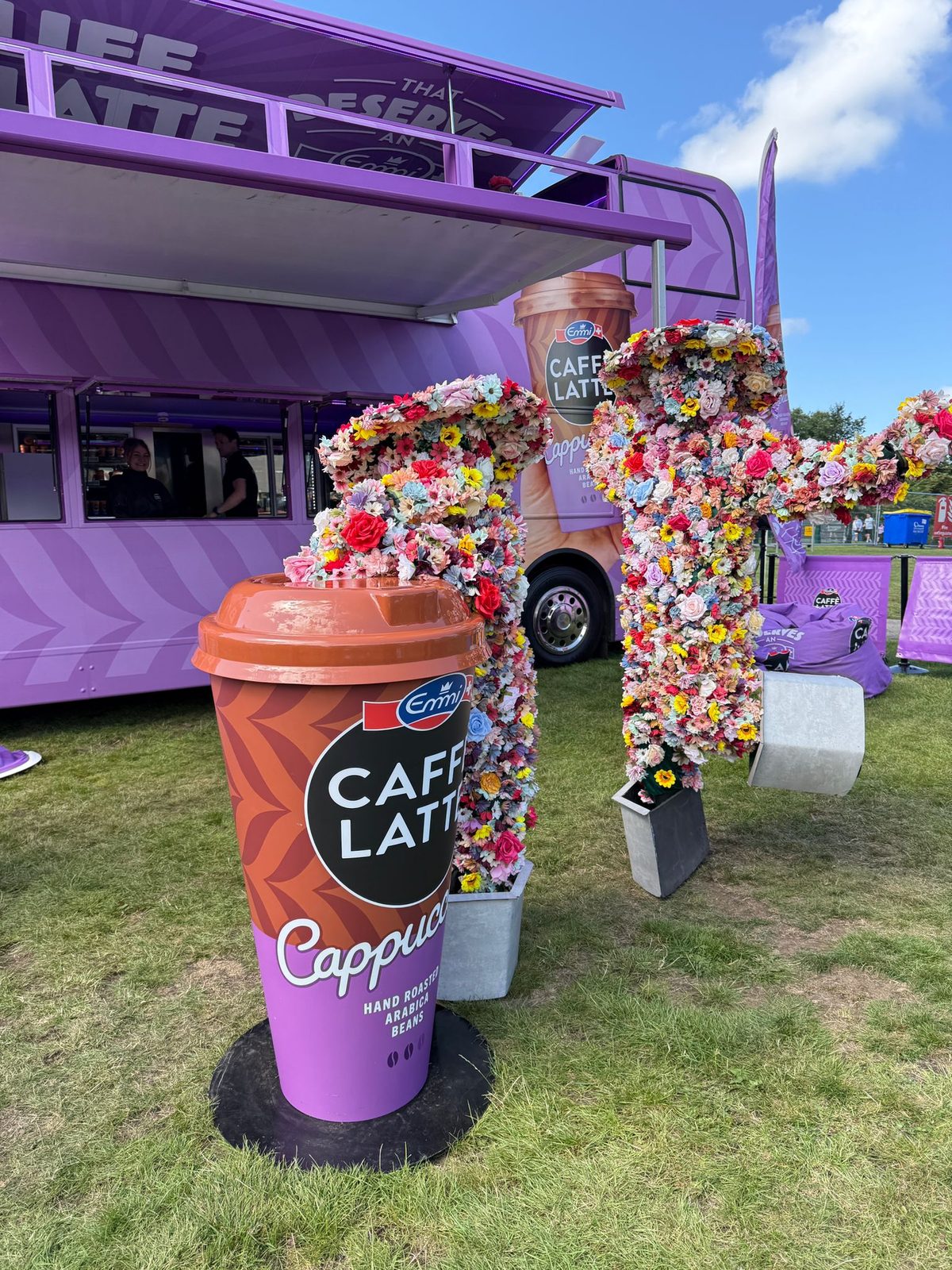 Brand ambassadors handing chilled coffee to festival-goers in the park