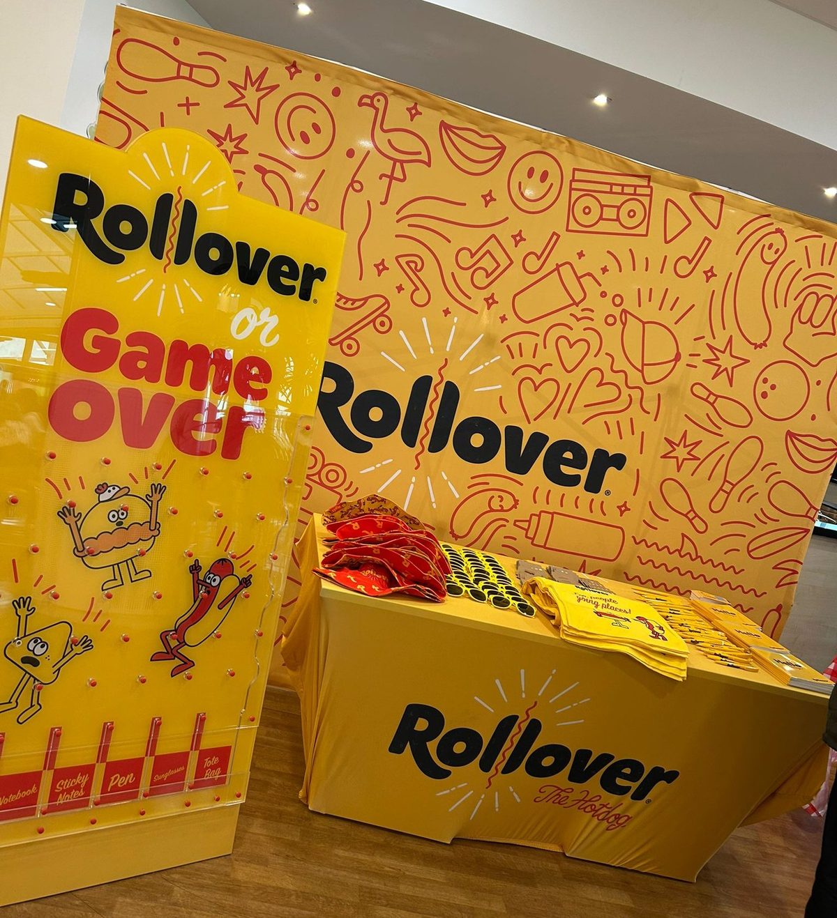 Students playing a Plinko game on the Rollover stand during Freshers Week