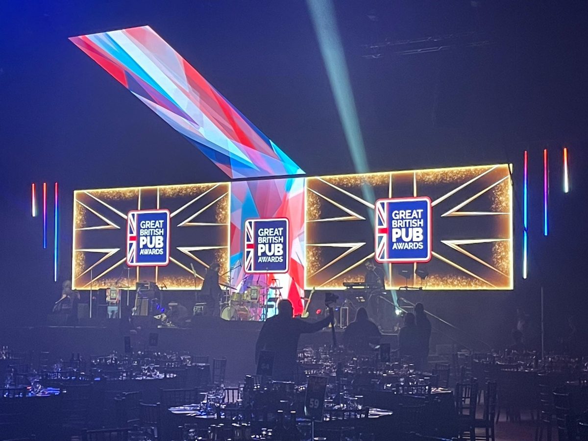 Bar staff pouring draught beer at the Great British Pub Awards in Leeds