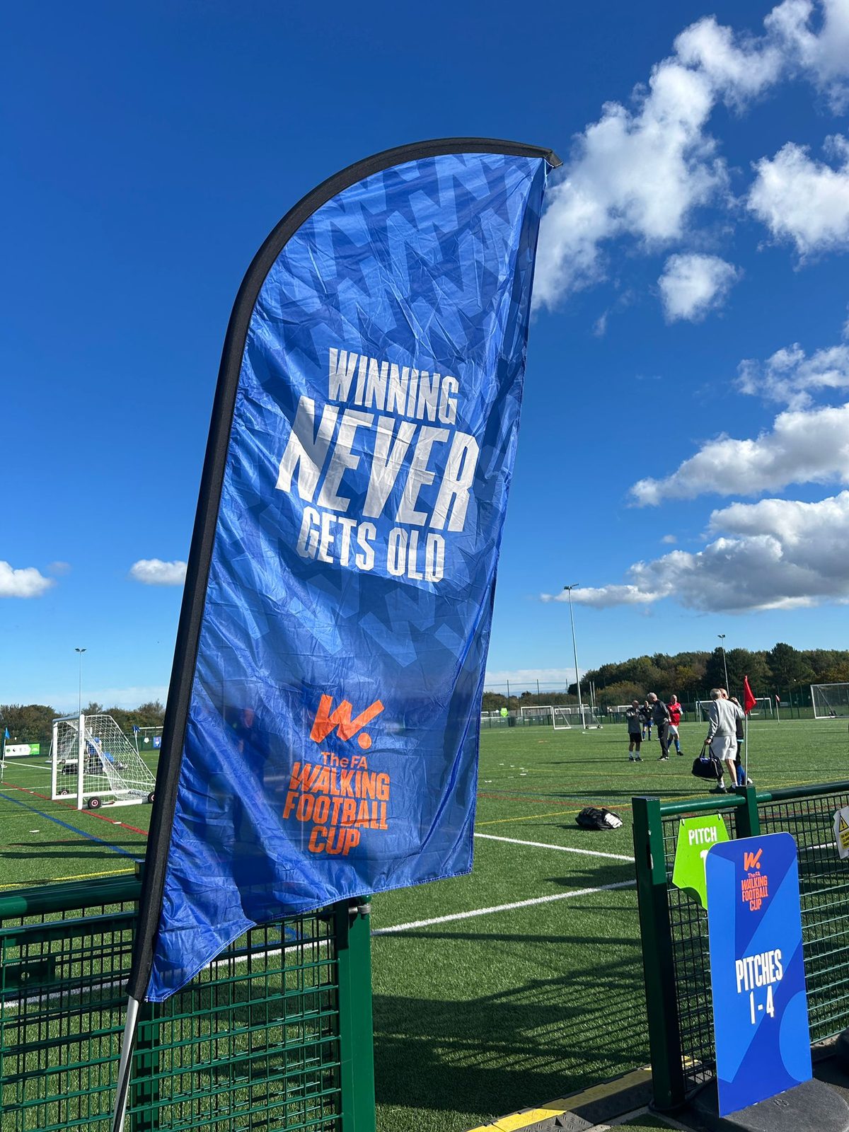 event staff running team registration at a walking football tournament