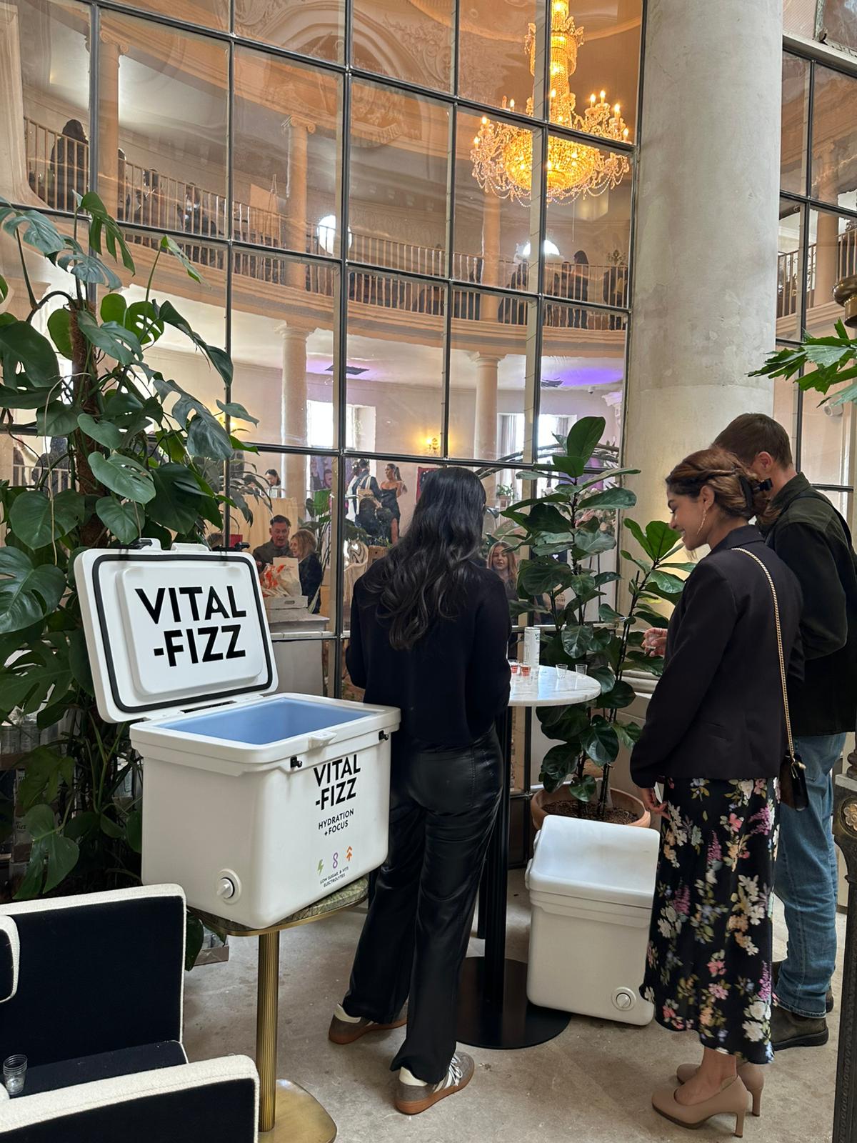 Brand ambassadors chatting to guests at the Vital Fizz stand in London