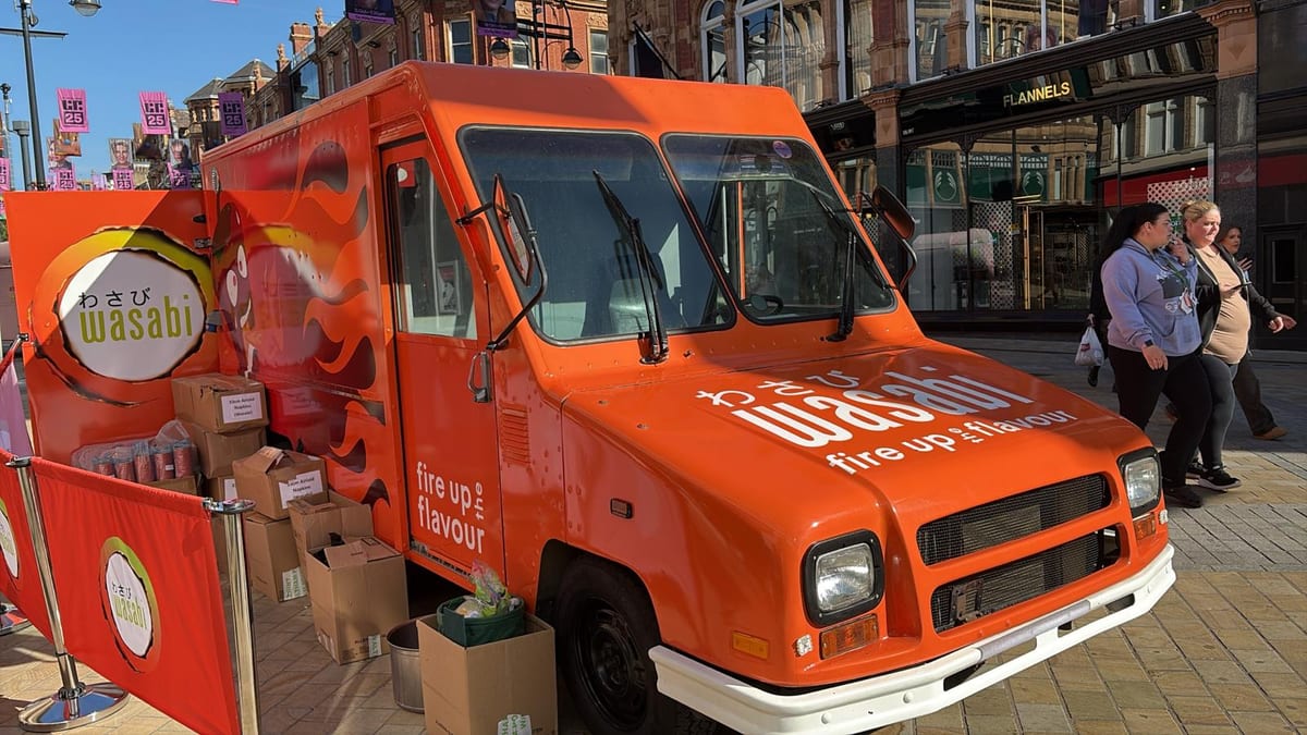 sampling team beside the branded Wasabi fire truck on a Leeds high street
