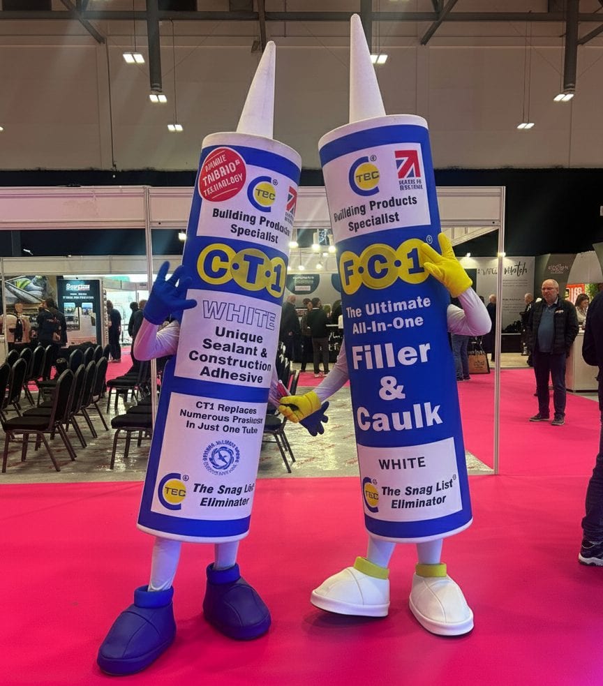 CTEC character posing for a photo with an exhibition visitor