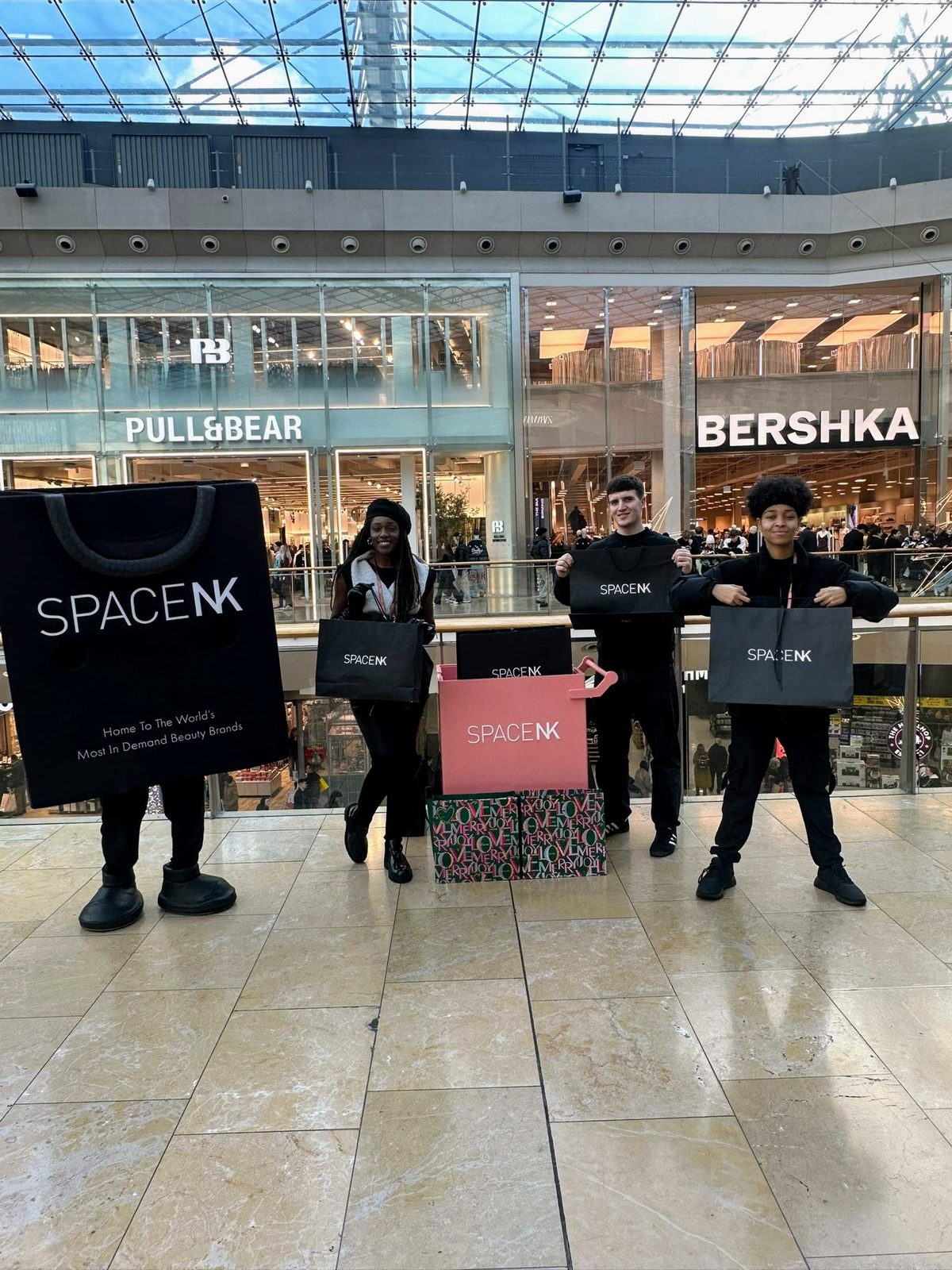 Promotional staff handing out lollipops at Space NK in the Bullring Centre, Birmingham