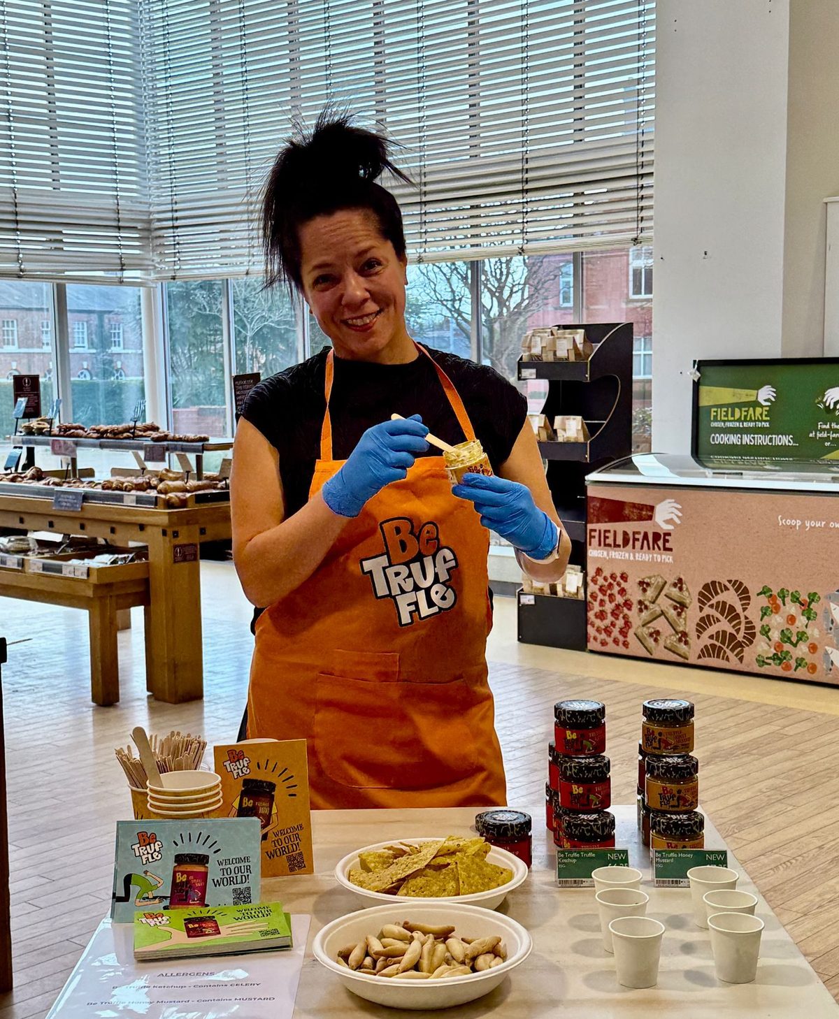 sampling staff offering Be Truffle tastings in a Booths store
