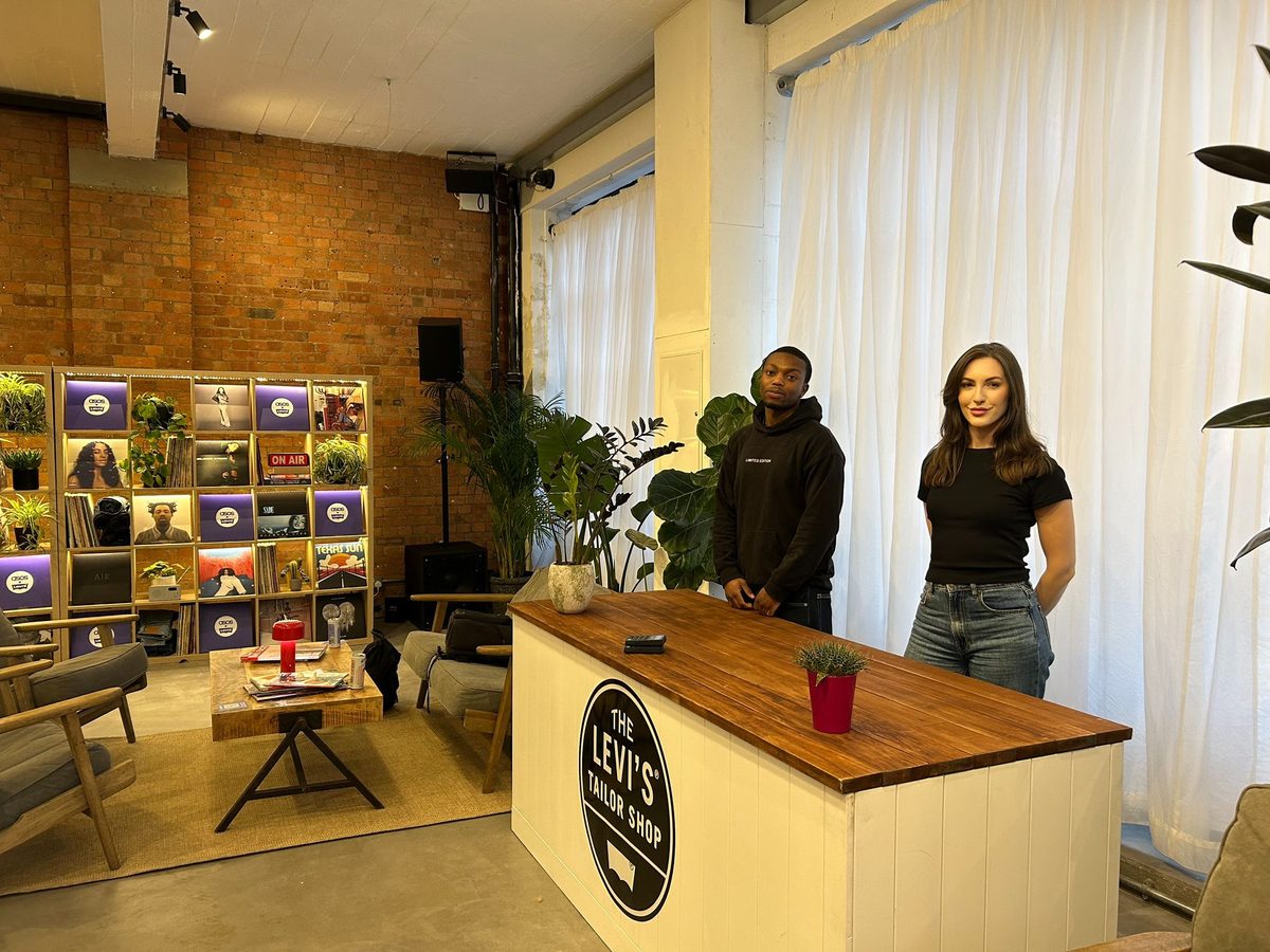Two staff at the Levi's Tailor Shop counter in a London store