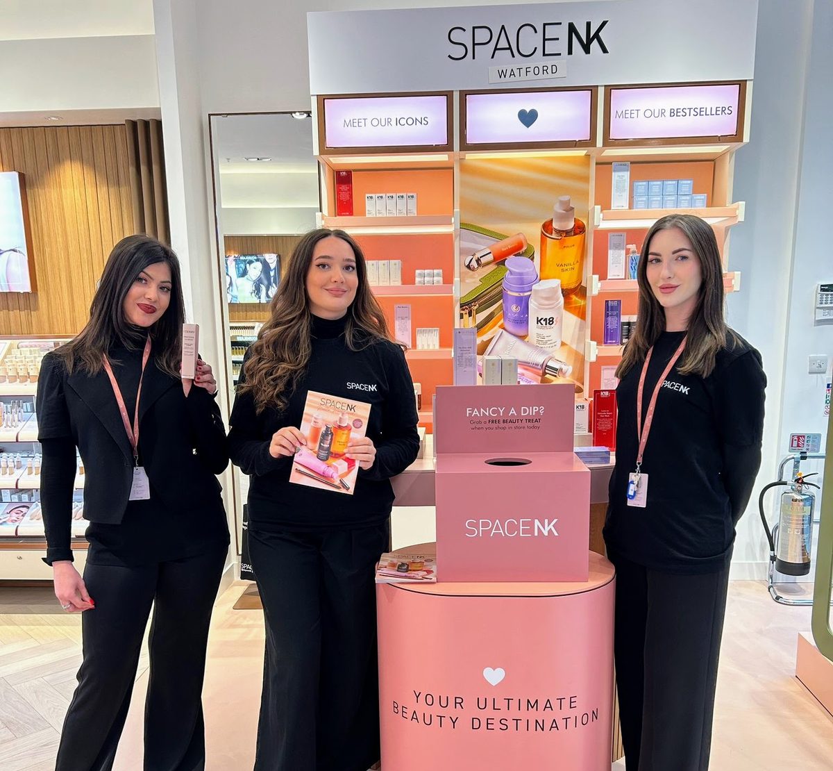Three promotional staff at the Space NK Watford store opening