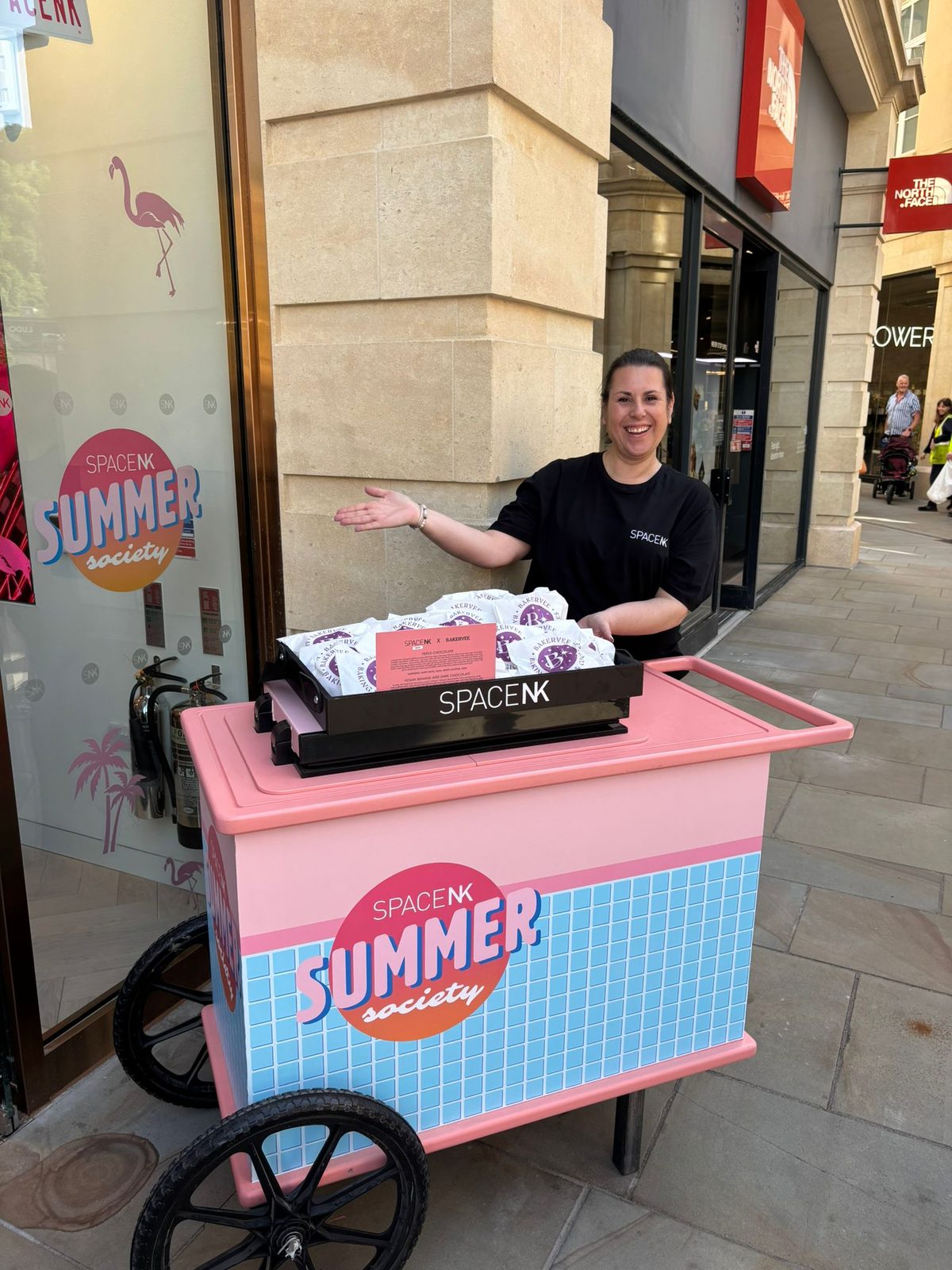 Promotional staff at a Space NK summer cart on a high street in Bath