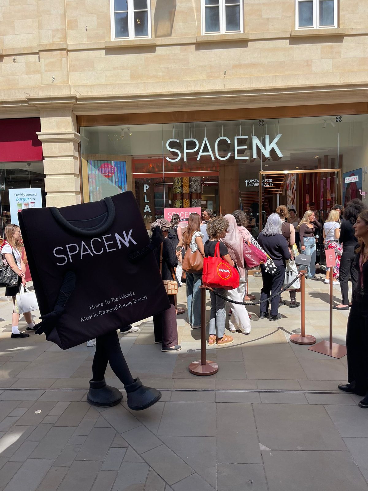 Mascot characters appearing outside the Space NK store in Bath