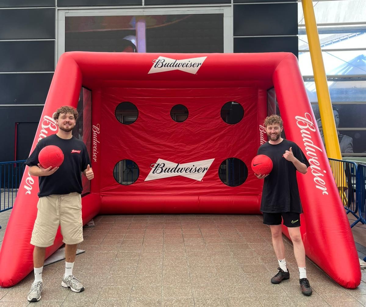 Two brand staff ready to run a Budweiser kicking game at The O2