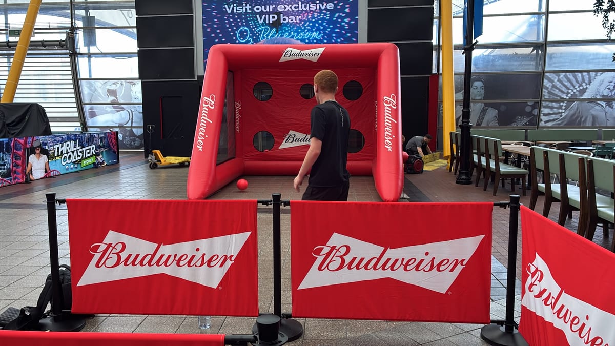 Brand ambassadors running the Budweiser inflatable kicking game at The O2 Arena