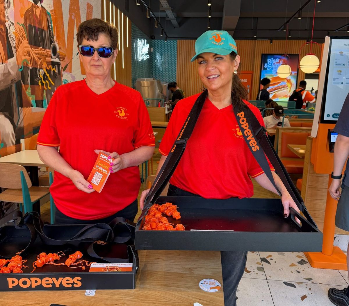 Two brand ambassadors handing out Popeyes samples at the Glasgow fan zone