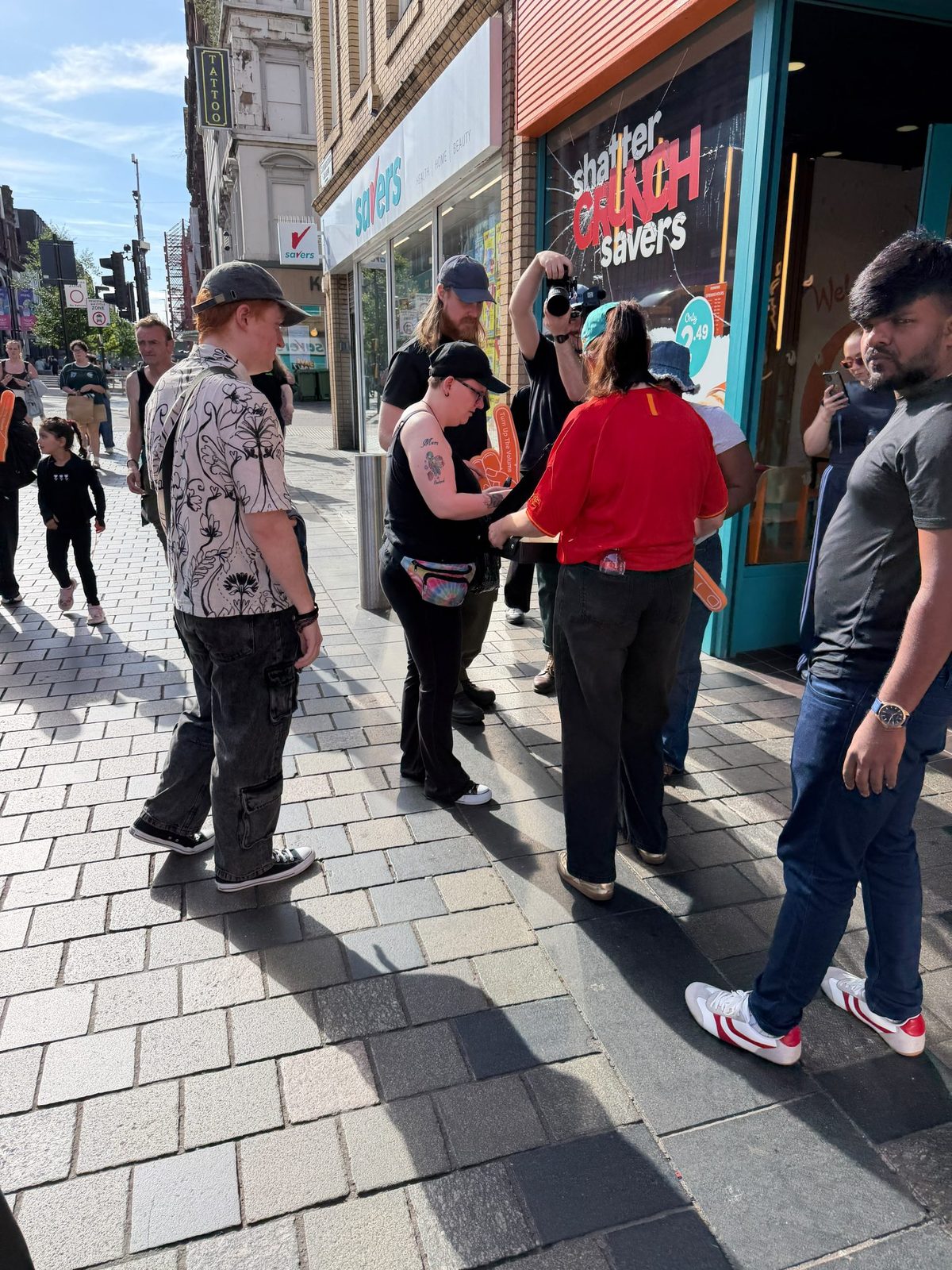 Brand ambassadors handing out vouchers to football fans in Glasgow city centre