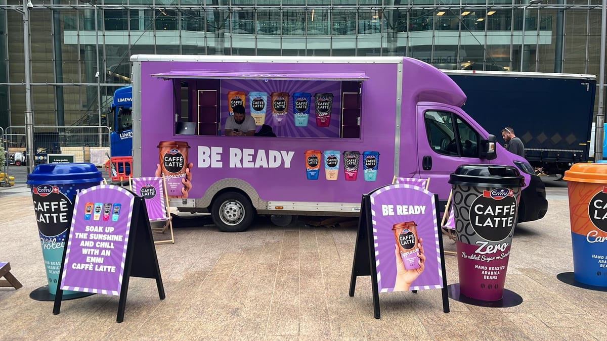 Emmi sampling team handing out iced coffee at an event on the UK roadshow