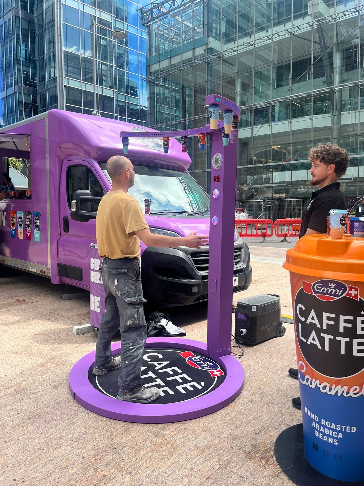 Executional roadshow team at a touring brand vehicle in London