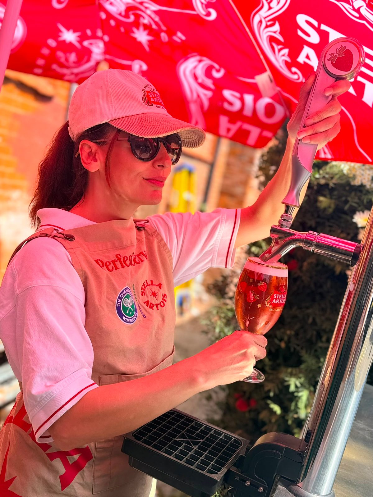 Stella Artois brand ambassador pouring at the pick your own wall in Wimbledon