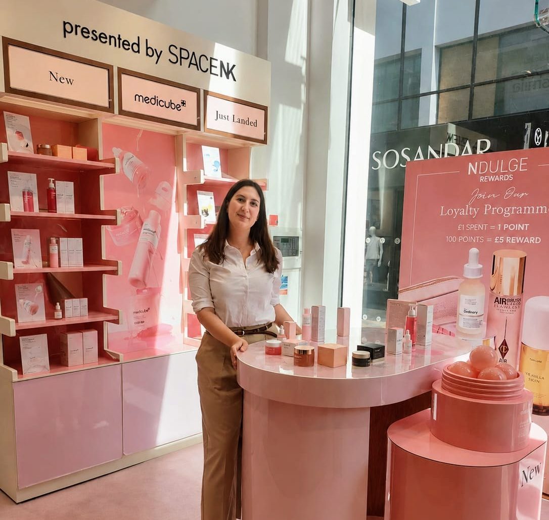 Brand ambassador at the Medicube stand in a Space NK store