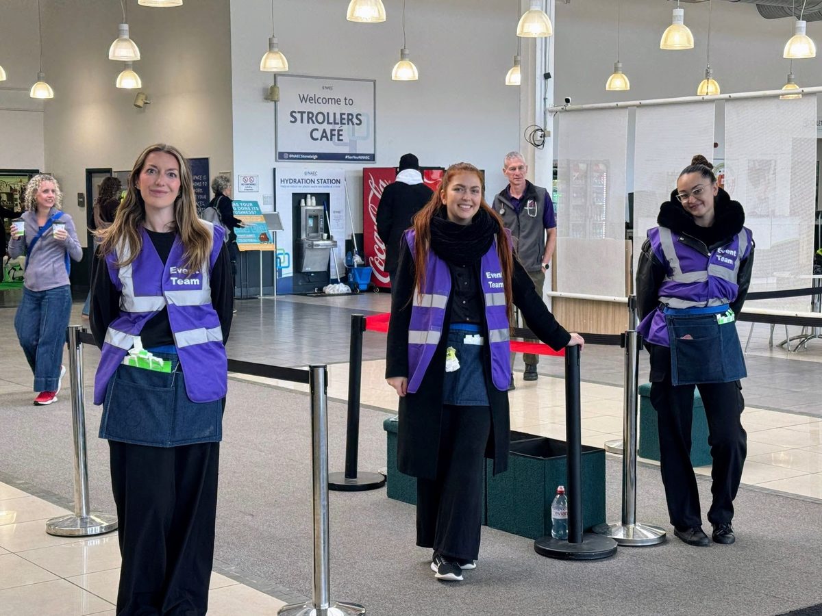 Event welcome team in purple hi-vis at the entrance to Edition Dog Live at Stoneleigh Park