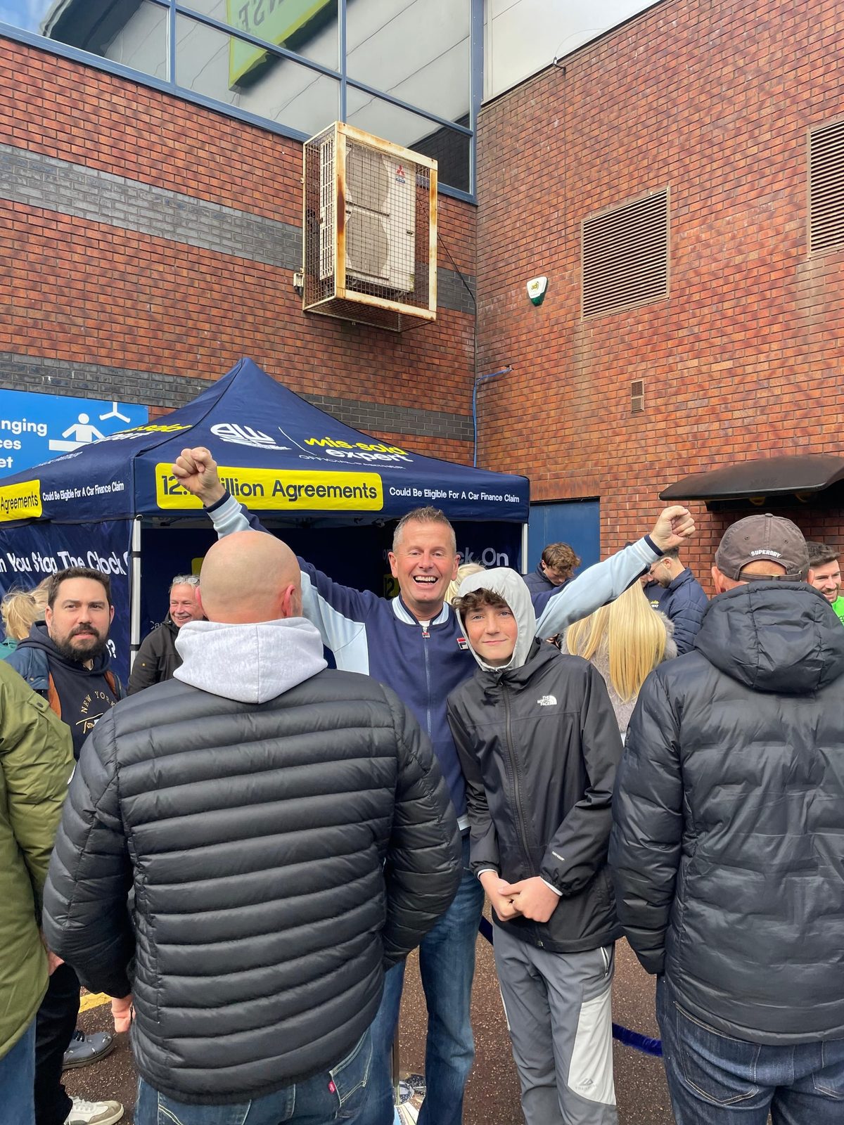 Bolton fans celebrating at The 12.1 Challenge stand on matchday