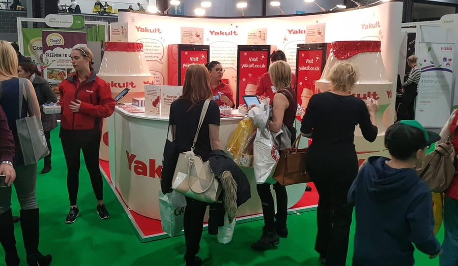 EXECUTIONAL staff welcoming visitors on a busy exhibition stand
