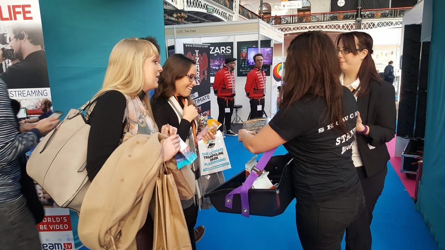 EXECUTIONAL stand staff talking to visitors and capturing leads on an exhibition stand