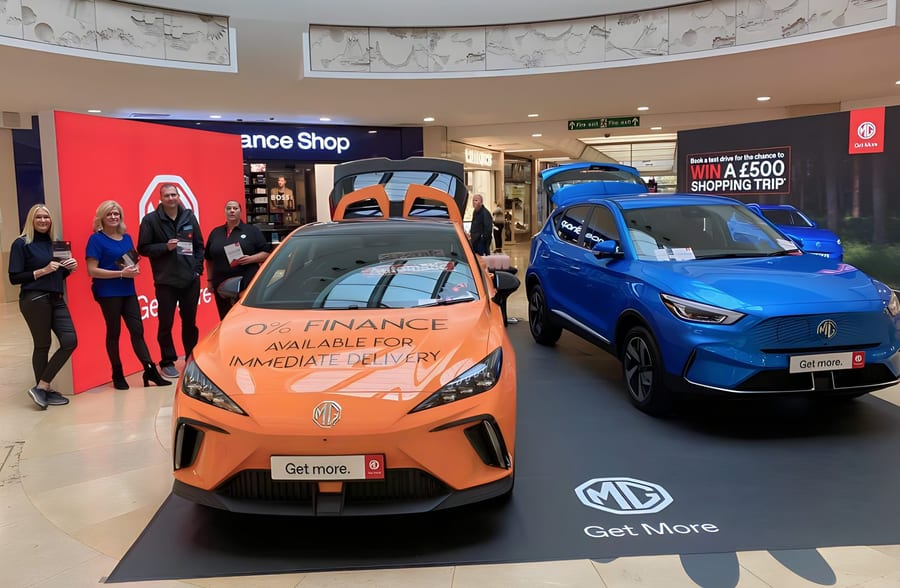 EXECUTIONAL promotional models beside MG electric cars at St David's shopping centre in Cardiff