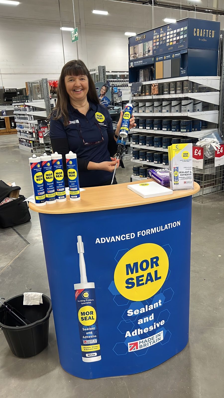 EXECUTIONAL team member beside a Morseal unit in a DIY store aisle