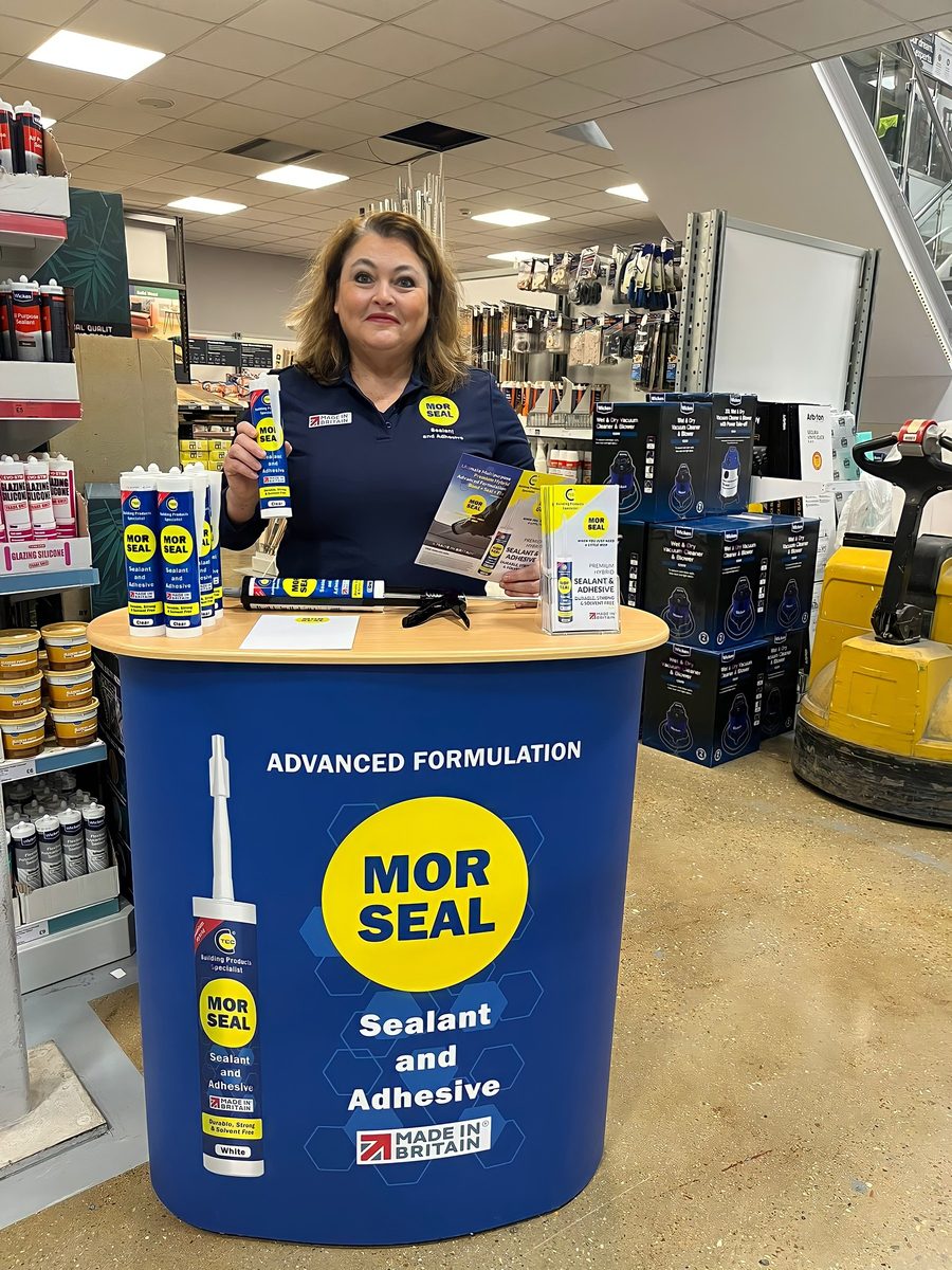 EXECUTIONAL team member in a DIY store aisle beside a Morseal unit