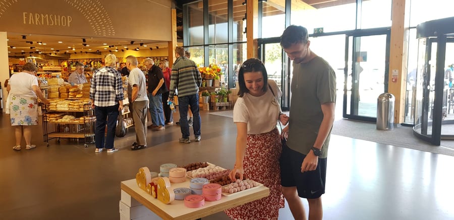 Shoppers browsing a display in a UK store