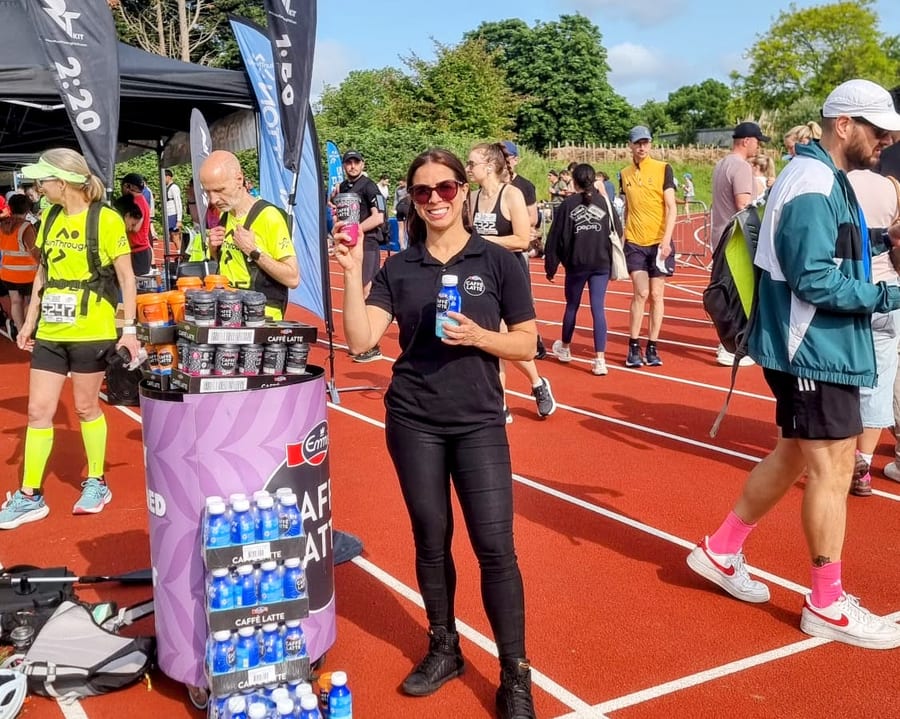 EXECUTIONAL team handing out Emmi Caffè Latte to runners at the RunThrough finish in Finsbury Park
