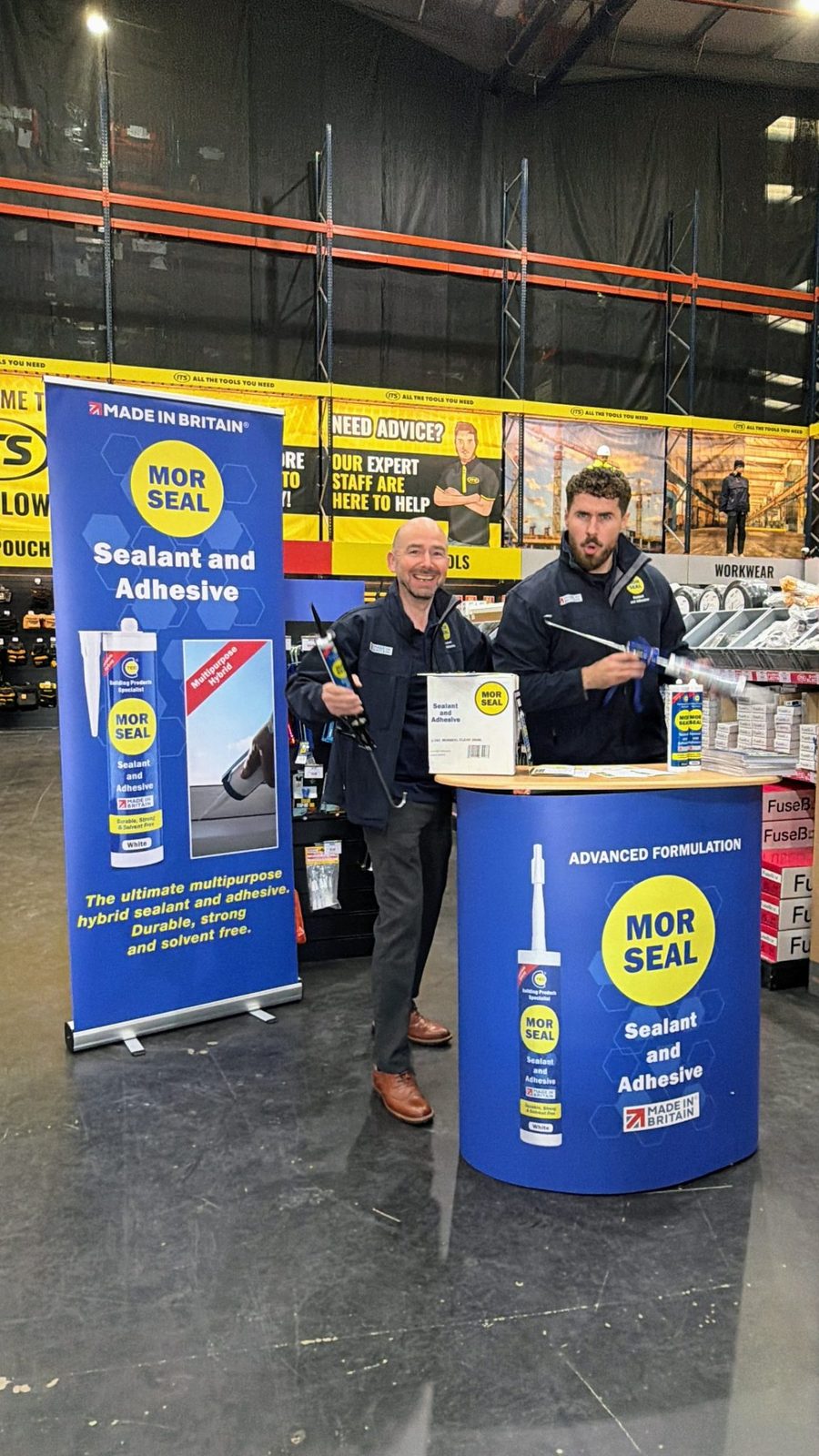 EXECUTIONAL staff beside a Morseal display unit in an ITS store