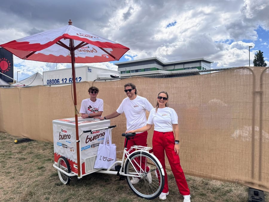 EXECUTIONAL team sampling Kinder ice cream from a trike at Reading Festival
